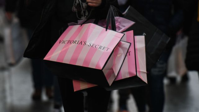 A shopper walks with a Victoria Secret bag in Lennox Mall in