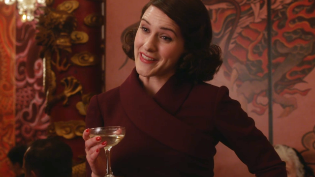 Rachel Brosnahan as Midge Maisel with a drinking glass in her hand from "The Marvelous Mrs. Maisel" Season 1