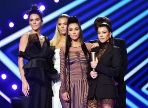 SANTA MONICA, CA - NOVEMBER 11: 2018 E! PEOPLE'S CHOICE AWARDS -- Pictured: (l-r) TV personalities Kendall Jenner, Khloe Kardashian, Kim Kardashian, Kourtney Kardashian, and Kris Jenner accept The Reality Show of 2018 award for "Keeping Up with the Kardashians" on stage during the 2018 E! People's Choice Awards held at the Barker Hangar on