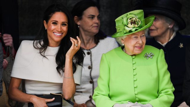 CHESTER, ENGLAND - JUNE 14: Queen Elizabeth II sits and laughs with Meghan, Duchess of Sussex accompanied by Samantha Cohen (Back, C) during a ceremony to open the new Mersey Gateway Bridge on June 14, 2018 in the town of Widnes in Halton, Cheshire, England. Meghan Markle married Prince Harry last month to become The Duchess of Sussex and this is her first engagement with the Queen. During the visit the pair will open a road bridge in Widnes and visit The Storyhouse and Town Hall in Chester.