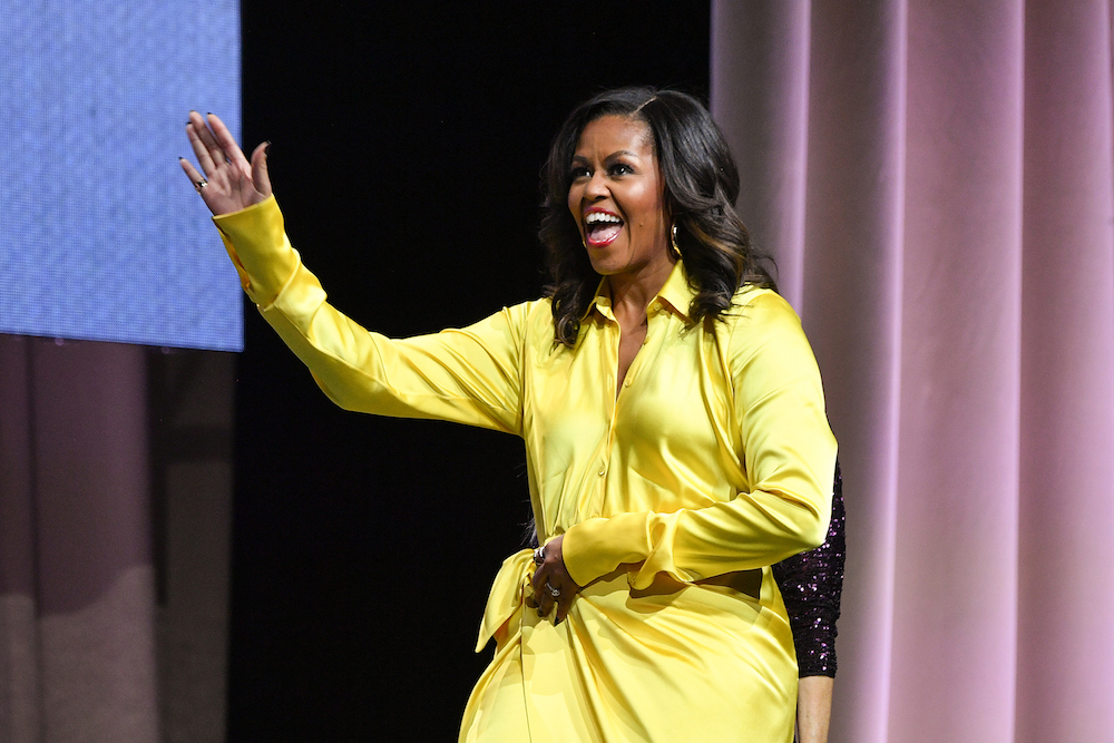 Michelle Obama Wore Gold Glittery Thigh High Boots On Her Book