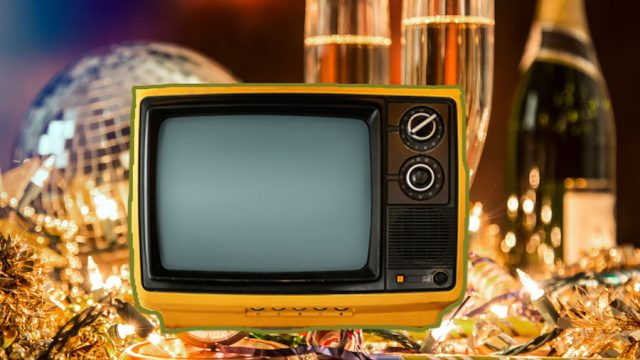 Vintage TV set on top of New Year's Ever party decorations