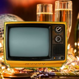 Vintage TV set on top of New Year's Ever party decorations