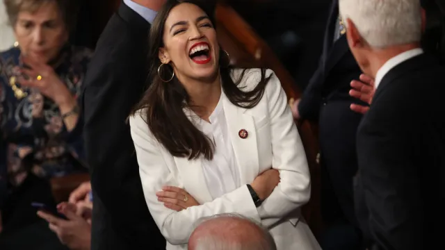 alexandria ocasio cortez white outfit meaning