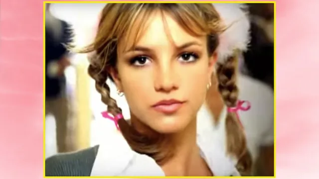 Britney Spears "...Baby One More Time" video over pink background