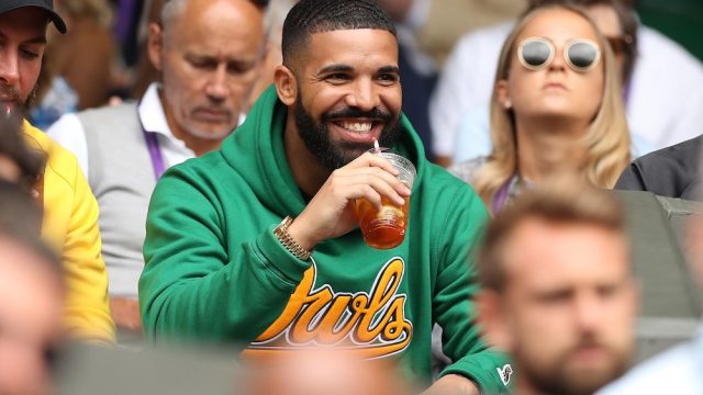 Rapper Drake sits on Centre Court before US player Serena Williams plays against Italy's Camila Giorgi during their women's singles quarter-final match on the eighth day of the 2018 Wimbledon Championships at The All England Lawn Tennis Club in Wimbledon, southwest London, on July 10, 2018.