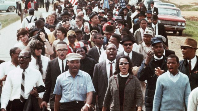 Martin Luther King and his wife Corette King lead a five-day march to the Alabama State Capitol