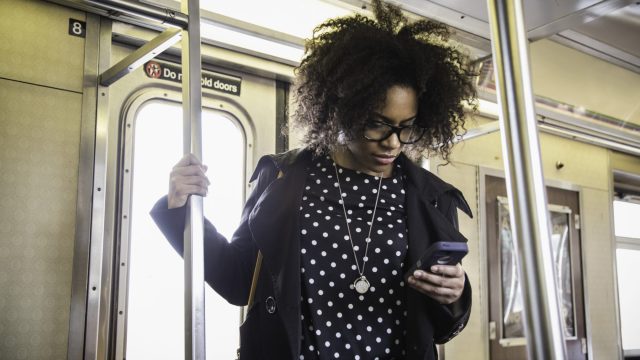 young black woman on the subway