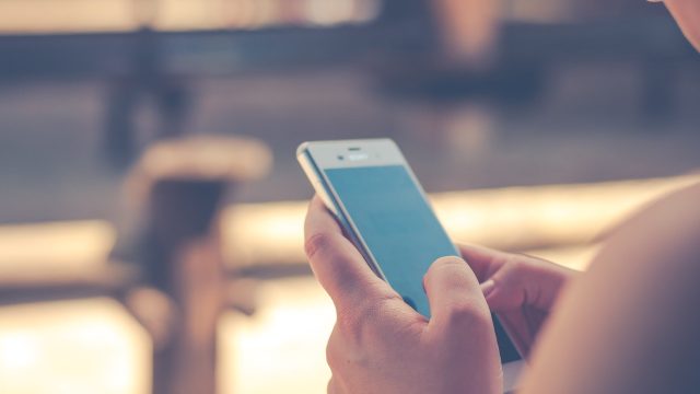 woman holding a cell phone