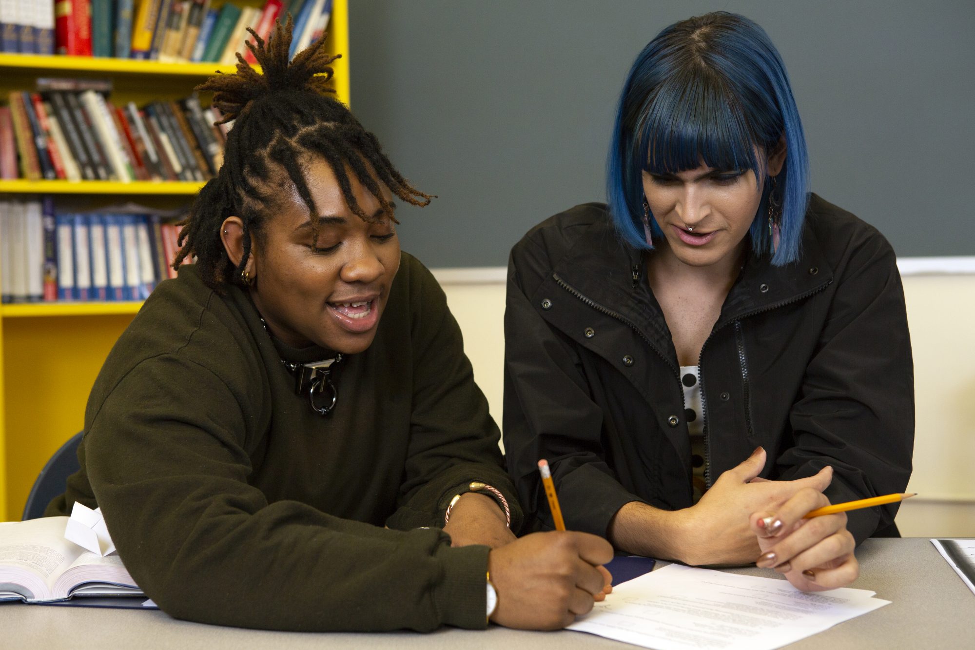 Two-non-binary-students-doing-work-together-in-class.jpg