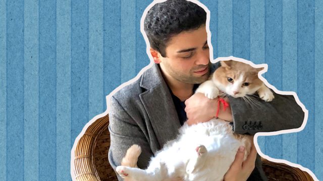 Author holding his cat on his lap