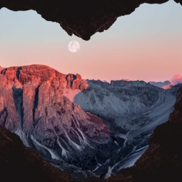 full moon framed by heart-shaped cave