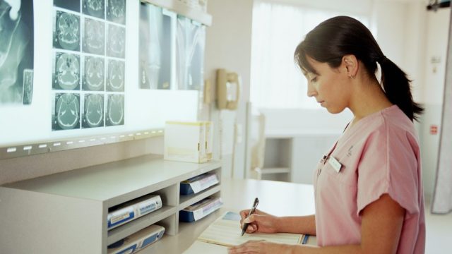 Nurse in traditional scrubs uniform.