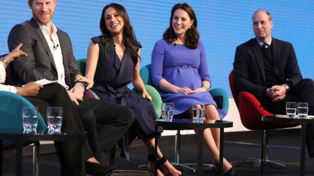 Prince Harry, Meghan Markle, Kate Middleton, and Prince William on stage during an event