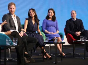 Prince Harry, Meghan Markle, Kate Middleton, and Prince William on stage during an event
