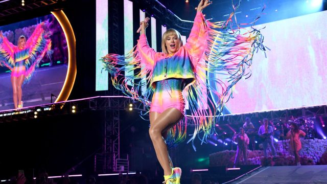 Taylor Swift performs at Wango Tango wearing a rainbow outfit