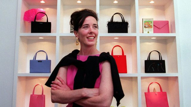Late designer Kate Spade poses for a portrait in her new handbag store on Newbury Street in Boston on June 25, 1999