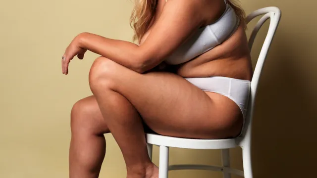 young woman sitting on chair