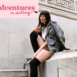 Shelby Sells posing in front of library with 'Adventures In Dating' logo by her face