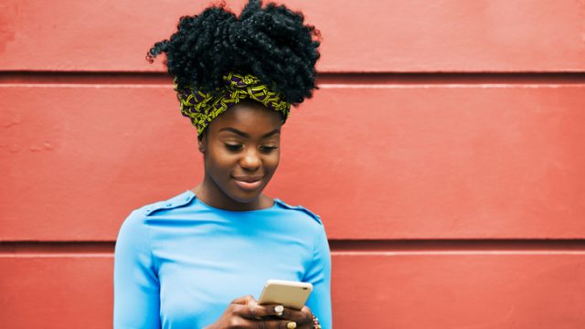 Woman texting on smartphone