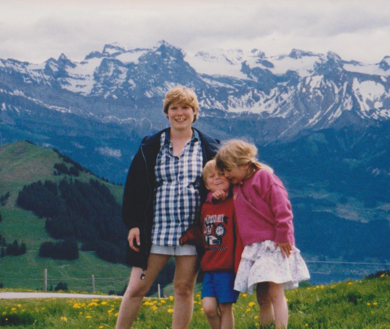 6-year-old me (right), on a mountain in a dress