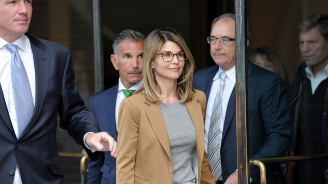 Actress Lori Loughlin exits the courthouse after facing charges for allegedly conspiring to commit mail fraud and other charges in the college admissions scandal