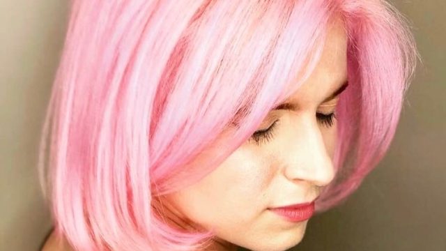 Author with pink hair