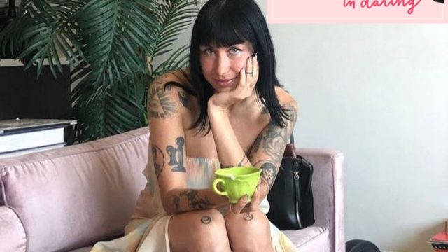 Author sitting on a couch with a cup of tea