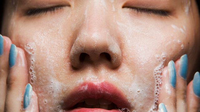 Woman washing face