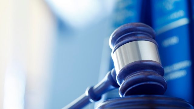 a wooden gavel on the sounding block