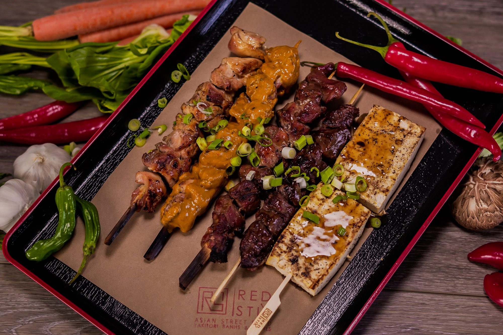 Chef Uno's newest restaurant, Red Stix, seeks to captures the sight, smell and taste of Asian street food; it’s a culmination of Chef Uno’s childhood memories and travels. Each hand-crafted bowl or sandwich is finished with a yakitori stick.