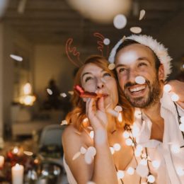 young couple celebrating holidays, interfaith couple hanukkah and christmas