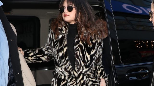 selena gomez in a zebra print faux fur coat