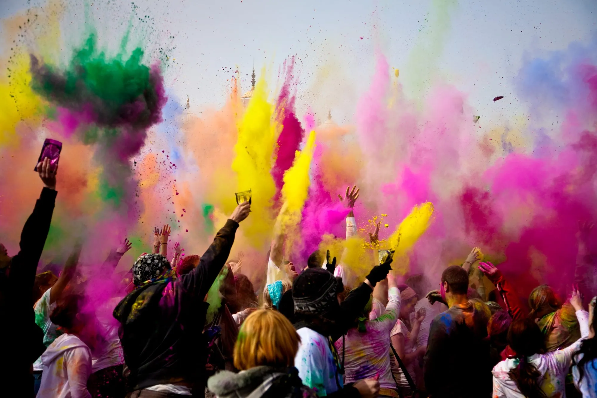 What is Holi, and why do people throw colored powder to celebrate