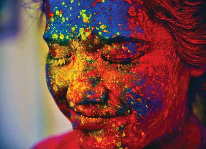 What is Holi, and why do people throw colored powder to celebrate