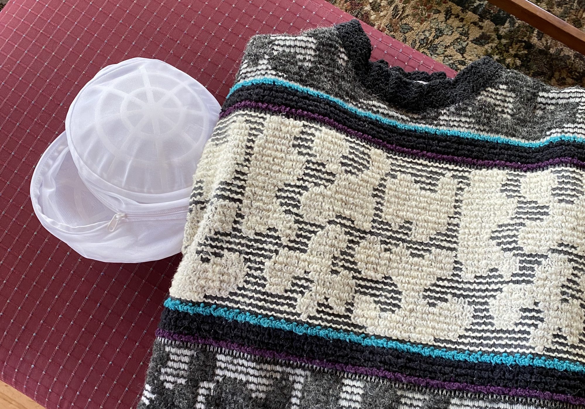 I fit this big, bulky sweater into this tiny mesh laundry bag.