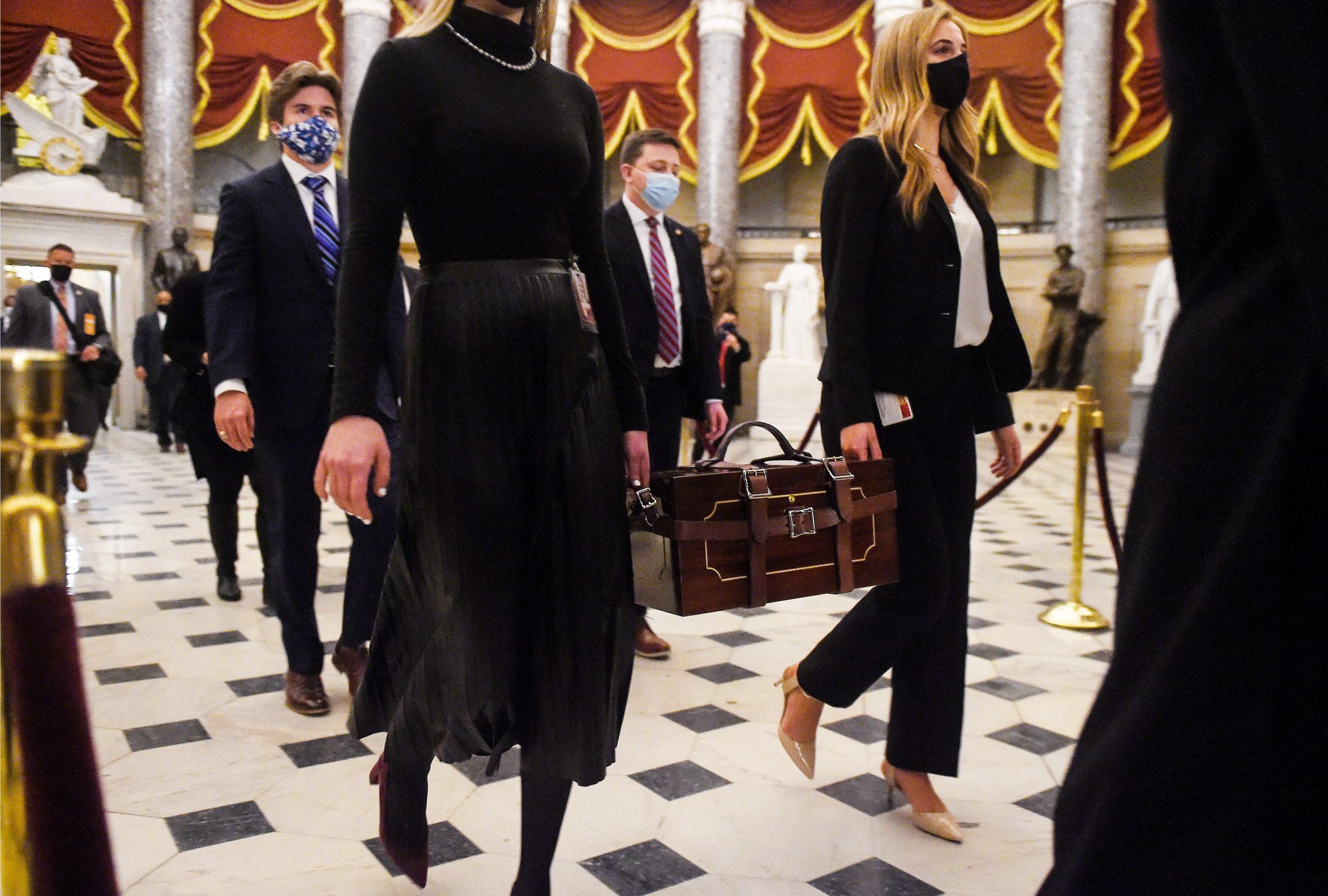 Senate aides carrying ballot boxes
