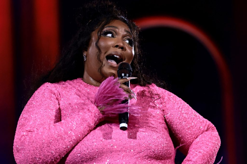 Lizzo performing in pink