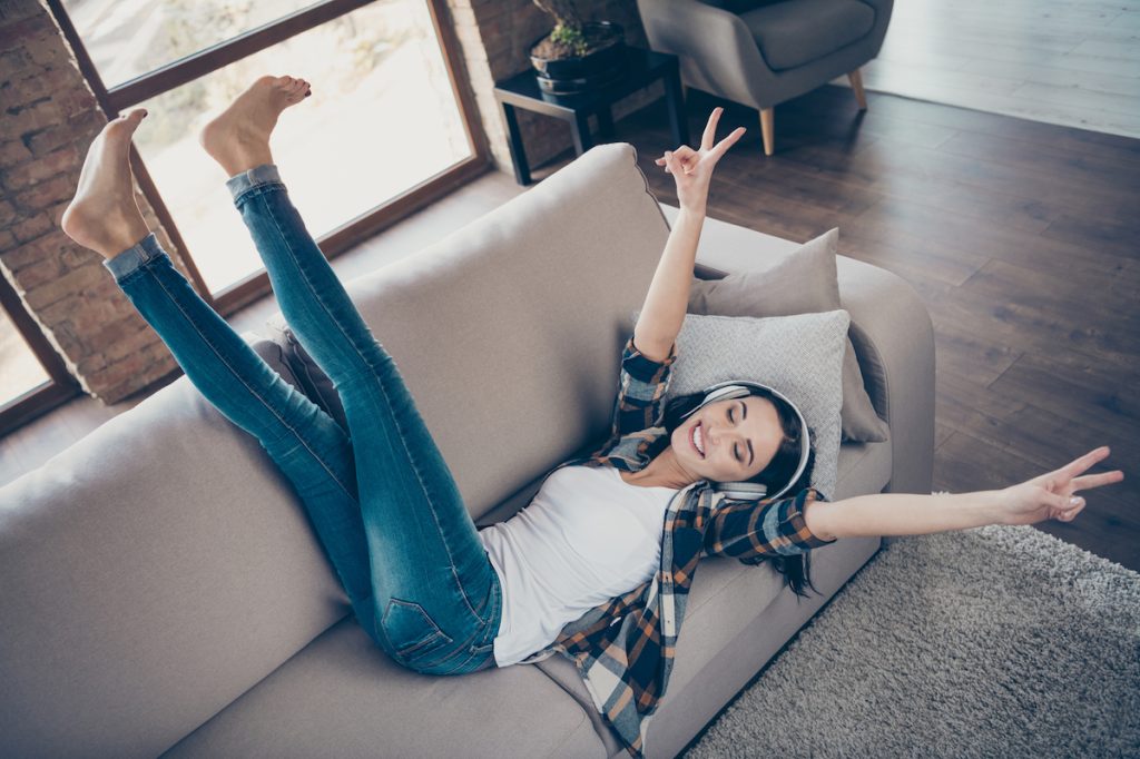 Woman Listening to Music on Couch