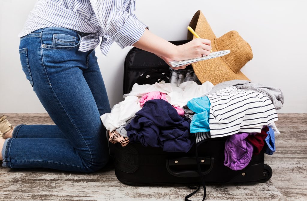 Woman Packing Suitcase