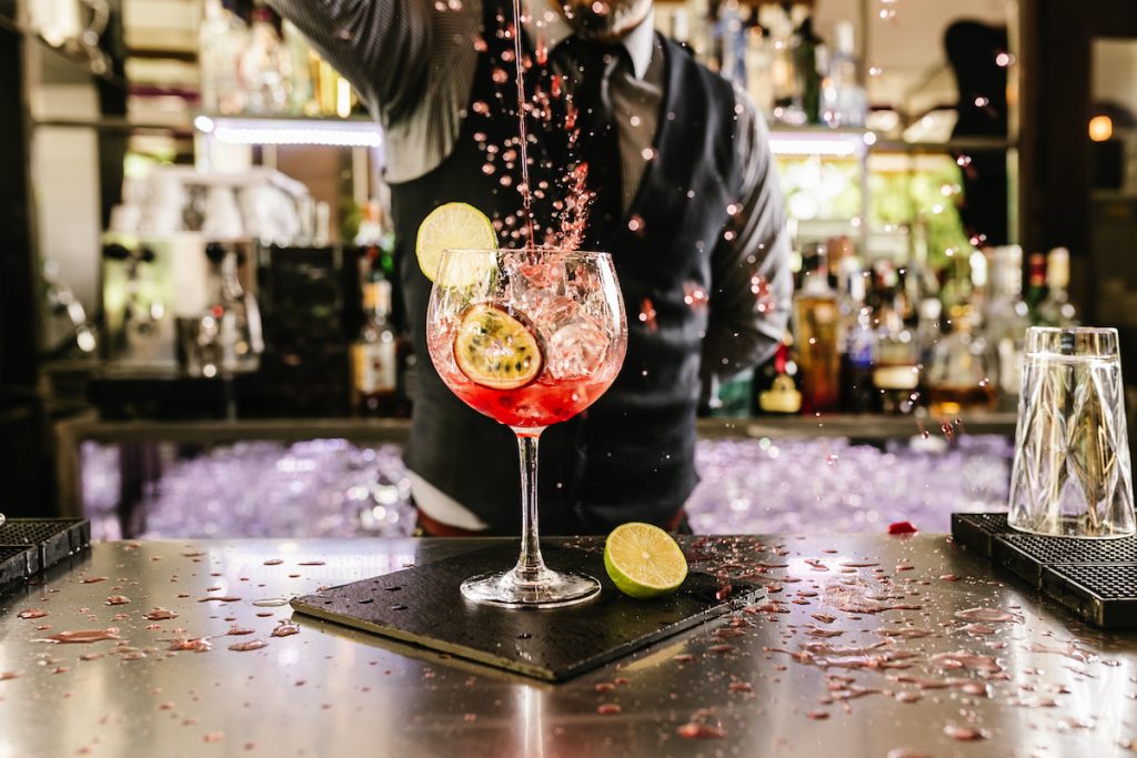 bartender pouring cocktail alcohol