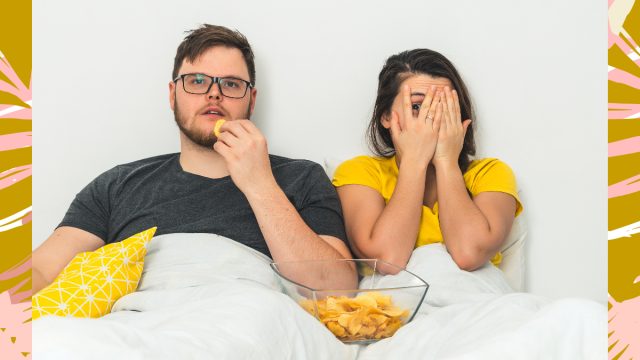 couple snacking in bed