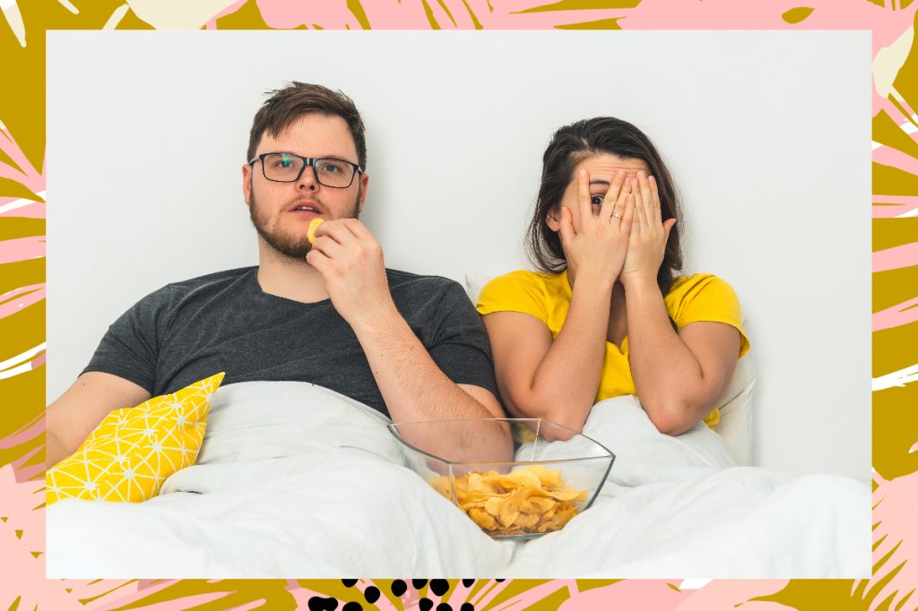 couple snacking in bed