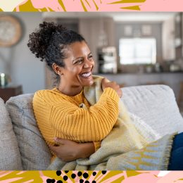 happy woman smiling on couch