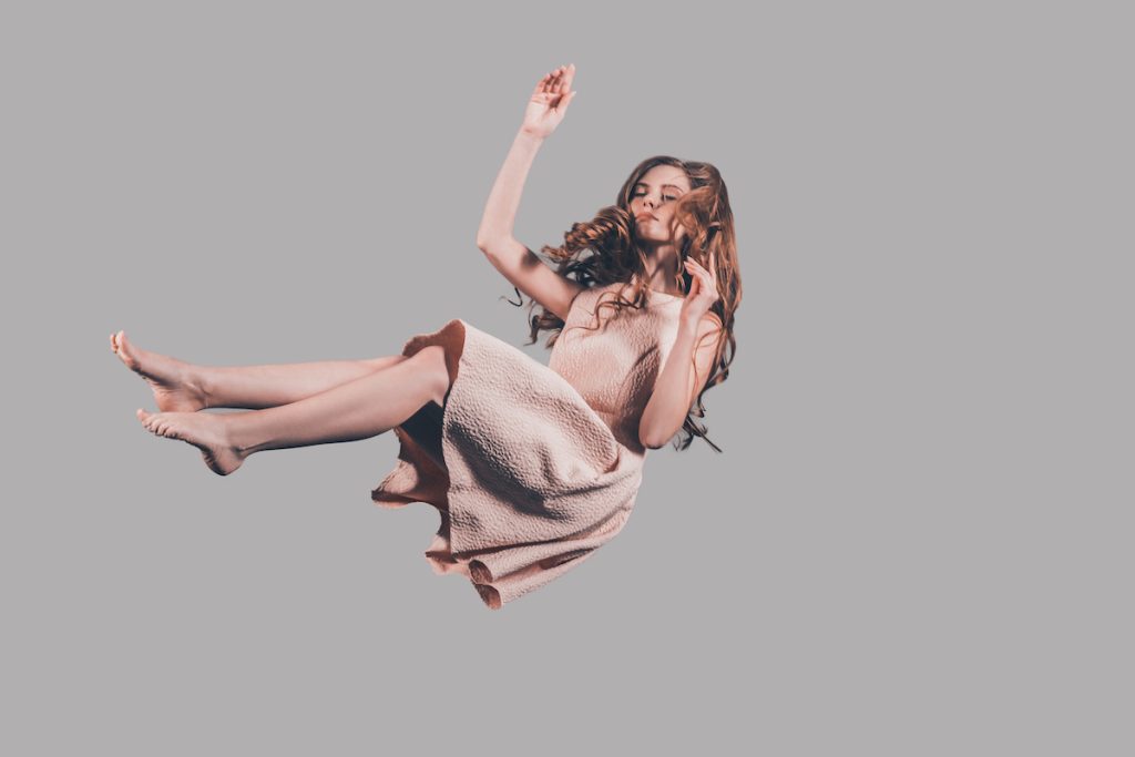 woman wearing dress falling