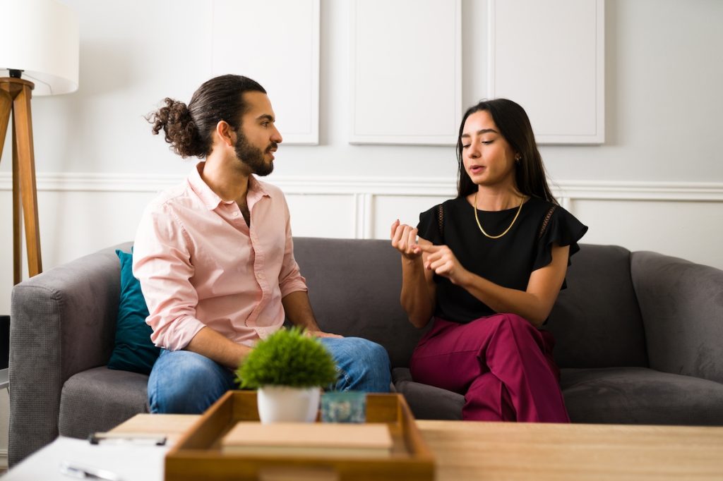 couple on couch talking