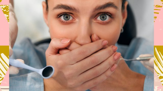 woman hiding teeth at the dentist