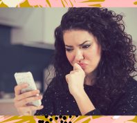 woman on phone confused using dating app