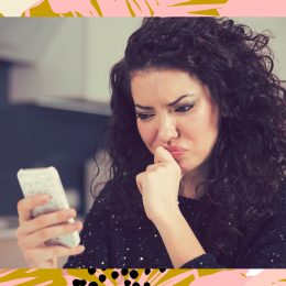 woman on phone confused using dating app