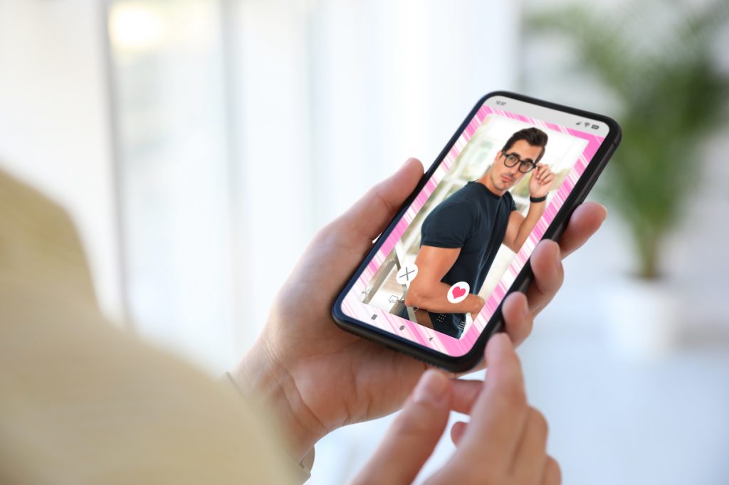 woman using dating app on phone